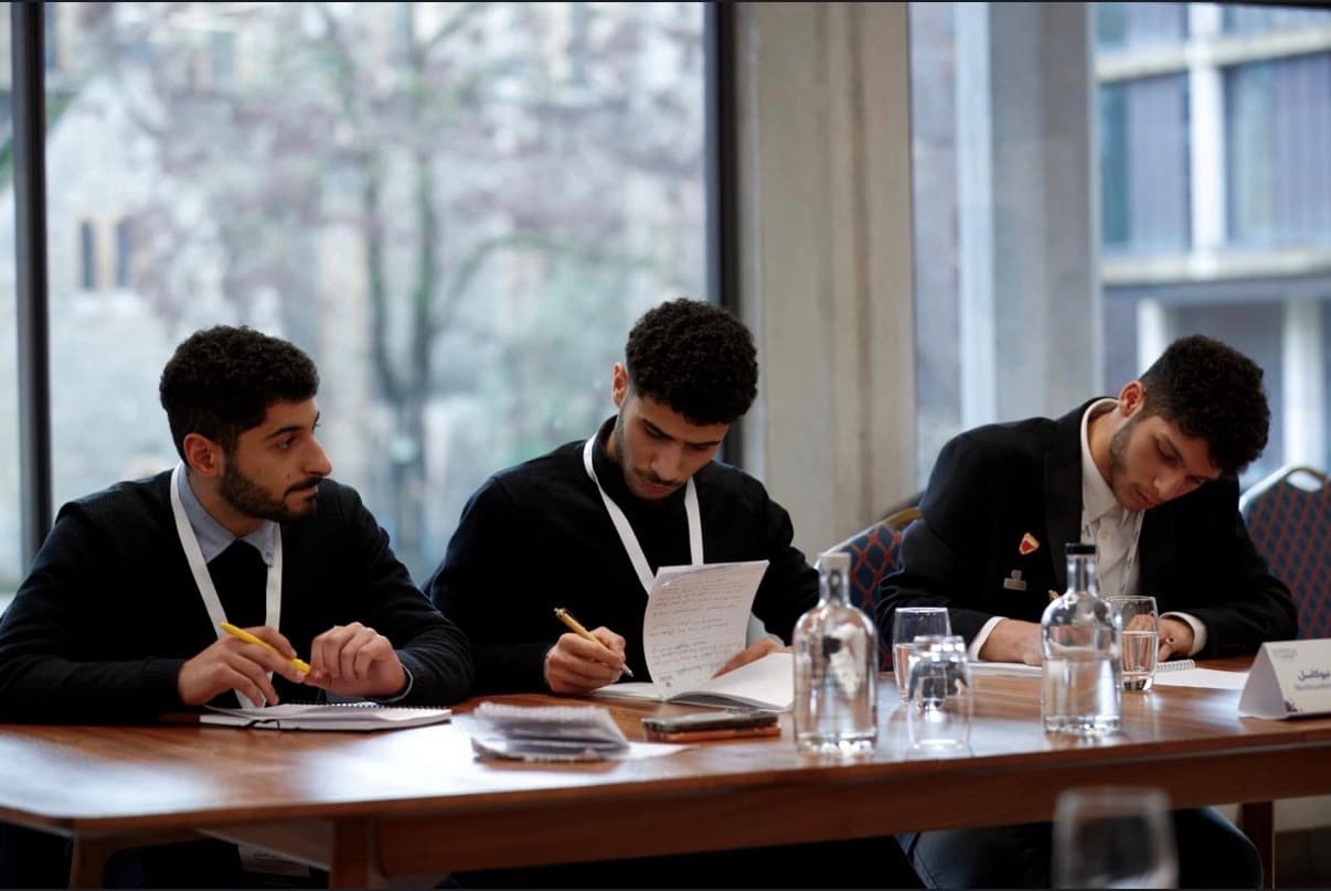 Northumbria debaters preparing case notes at the Oxford championship